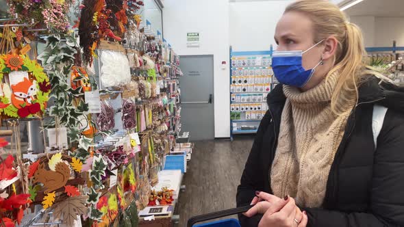 Woman buyer in a discounter store of homewares