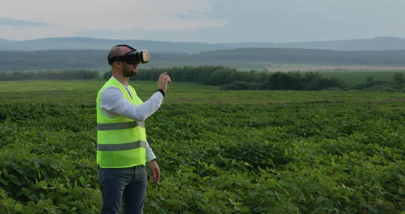 Farm Specialist Engineer Using Technology VR Monitoring Harvest Working for Agriculture Productivity