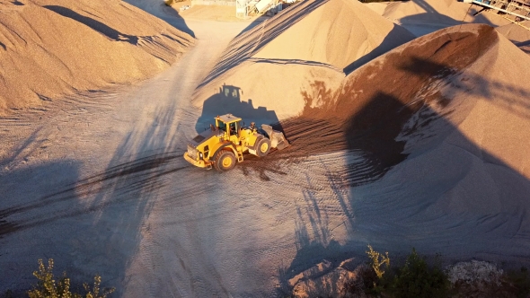 Bulldozer in Action in Open Air Quarry