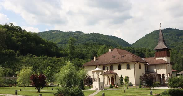 Ancient Lupsa Monastery In Alba County With A View Of Apuseni Mountains In Romania. static shot