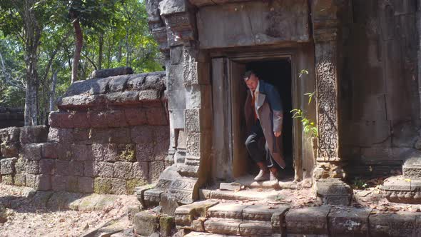 Foreign Actor Coming Out of the Temple and Down the Stairs