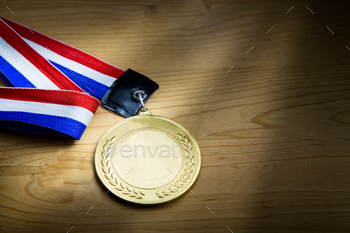 e ribbon on wooden surface against ray of light.  Fine art rendition.