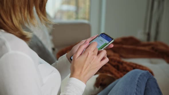 Woman Using Smartphone for Surfing News