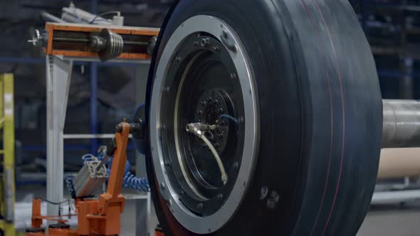 Tyre Production Machine Rotating with New Car Rubber Tire at Industrial Factory