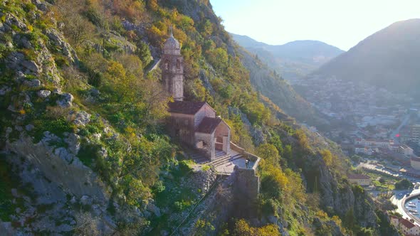 Aerial Shot of the Christian Church on a Way to the Top of the Mountain Where St