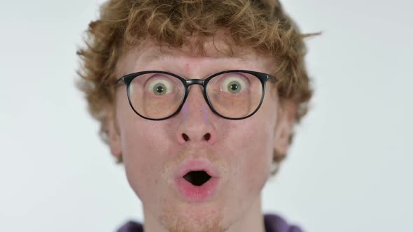 Close Up of Face of Shocked Redhead Young Man