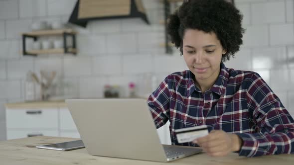 Success African American Woman Using Credit Card of Laptop