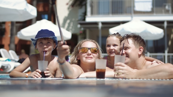 Family Taking Selfie in Pool