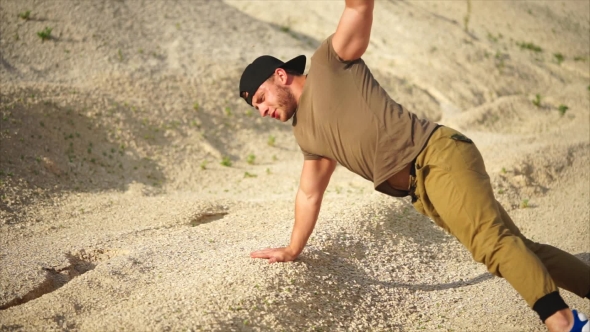 Sporty Man Does Push-up From the Ground, He Strengthens the Muscles of His Hands