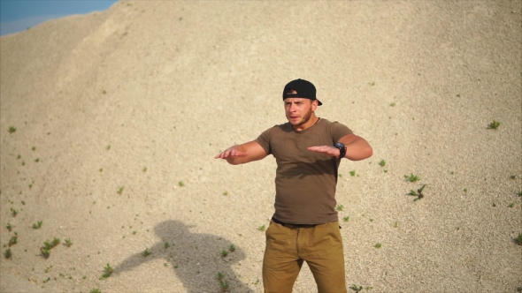 Athletic Man Doing Warm-up of Back and Arm Muscles Before Active Training