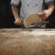The Chef's Hands Roll the Dough Into Pizza - VideoHive Item for Sale