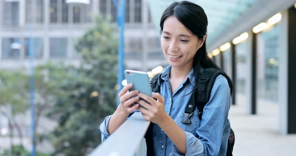 Woman talk to cellphone in the evening 