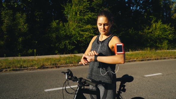 Girl with Smart Watch Traveling in Summer Park