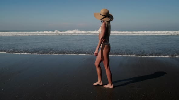 Pretty Happy Girl in Bikini at the Seaside