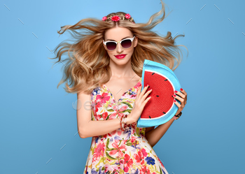 y Blond Model in fashion pose Smiling. Trendy Floral summer Dress, Stylish wavy hairstyle, fashion Flower Hairband. Playful Happy Romantic summer Girl