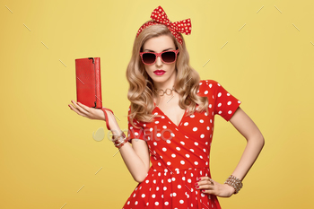 lish Curly hairstyle, Trendy Clutch, fashion Red Headband, Sunglasses. Beauty Blond Pinup Woman in fashion pose. Glamour Playful Sexy Lady on Yellow