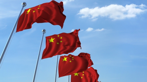 Row of Waving Flags of China Agaist Blue Sky alt