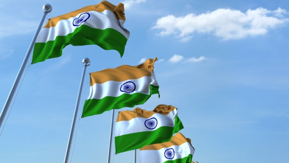 Row of Waving Flags of India Agaist Blue Sky alt
