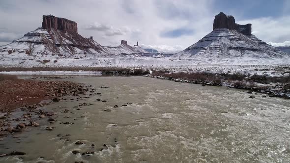 Flying over the rapids in the Colorado River viewing mesa in the desert