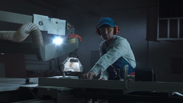 Man Working with Saw in Shop alt