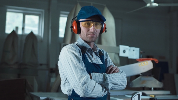 Worker Putting on Headphones