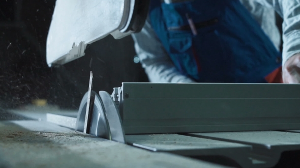 Worker Cutting Detail in Shop