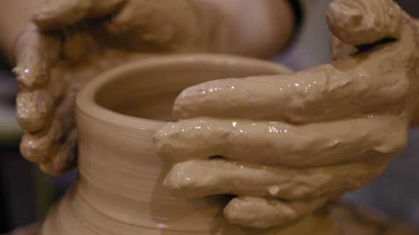 Potter Is Making Clay Pot on the Potter's Wheel