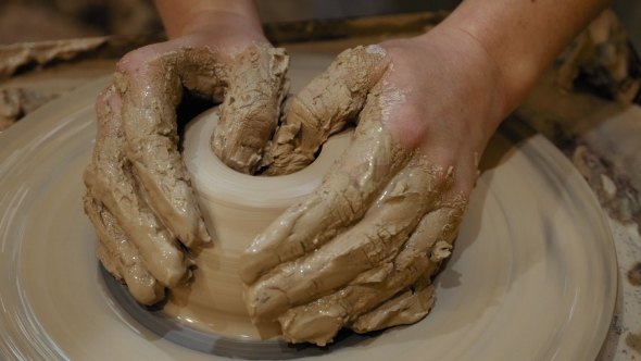 Potter Is Making Clay Pot on the Potter's Wheel