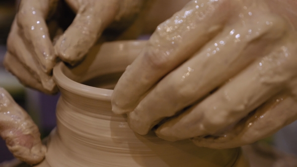 Potter Is Making Clay Pot on the Potter's Wheel