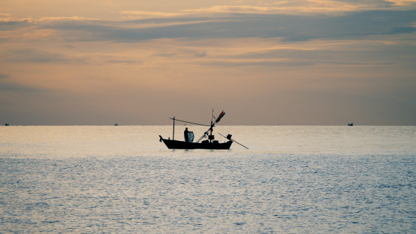 Fisherman On Boat At Sea