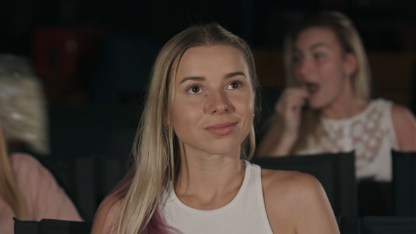 Young Woman Watch Film in the Cinema