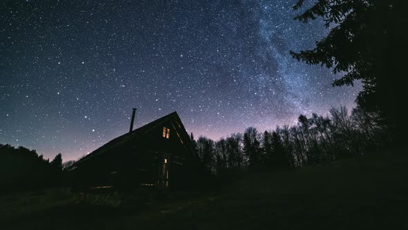 Fairytale Night Millions Stars of Milky Way Galaxy above Wooden Hut in Wild Forest