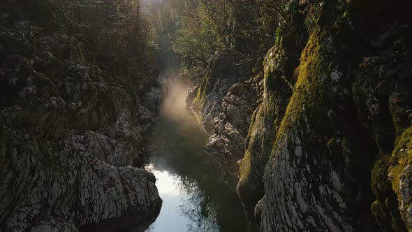 Flying Over a River Through a Narrow Canyon with White Rocks Sochi