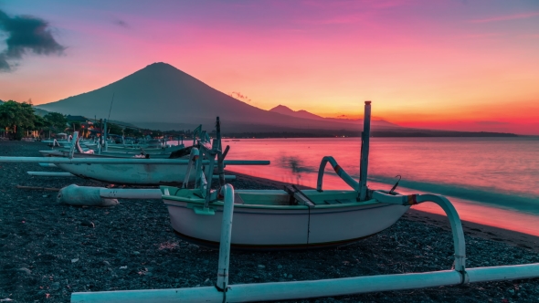 Sunset Overlooking the Agung Volcano  on the Background of Fishing Boats on the Beach of Djemeliuk i