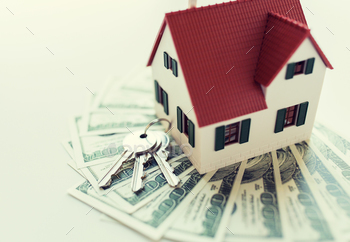 cept – close up of home model, dollar money and house keys