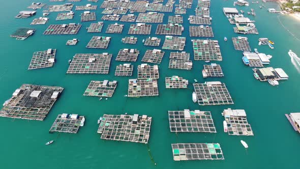 Aerial overview of fishing industry in Vietnam, fish farms in bay and scenic coastal. Nha Trang