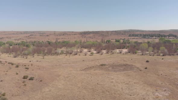 aerial flying towards a dried up river