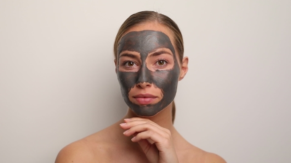Beautiful woman with grey face mask
