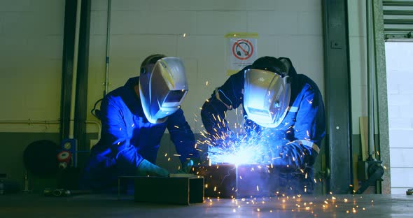 Robotic engineers working in robotic warehouse 4k