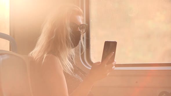 Woman In Transport Train In Protective Mask Sars COVID19 Virus.Pandemic Coronavirus Covid-19 Outdoor