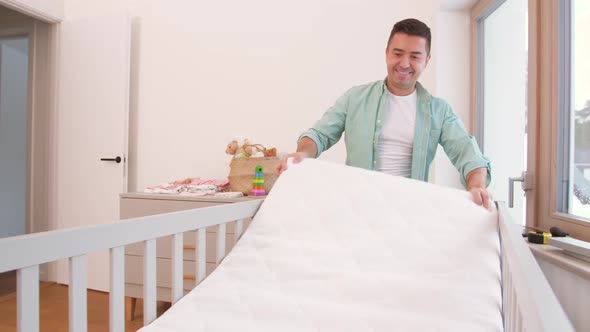 Father Arranging Baby Bed with Mattress at Home 17