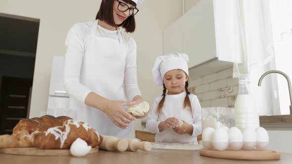 Mom and Daughter Prepare Pastries in the Kitchen