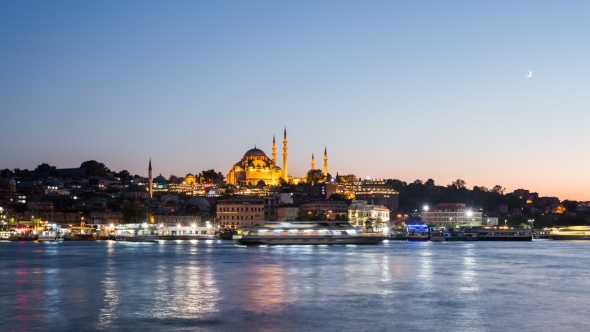 View of Istanbul Cityscape with Suleymaniye Mosque with Tourist Ships Floating at Bosphoru