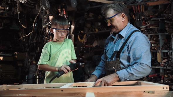 Man with Boy Making Window