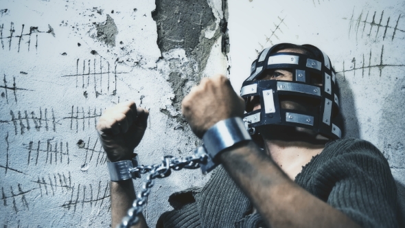 Prisoner in Chains Eats Food Brought