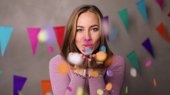 Party Girl blowing Confetti