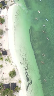 Vertical Video Boats in the Ocean Near the Coast of Zanzibar Tanzania