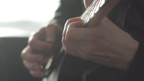 Man Playing on an Electric Guitar