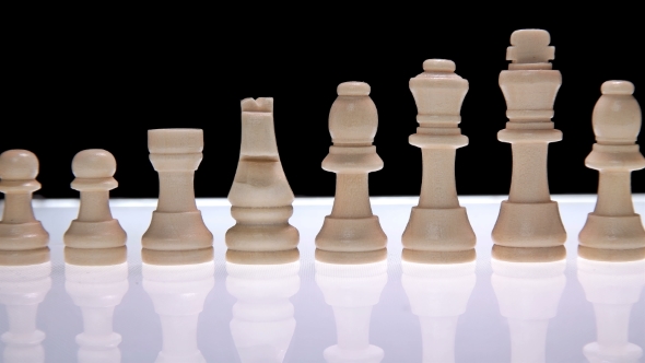 Line of Chess Pieces of White