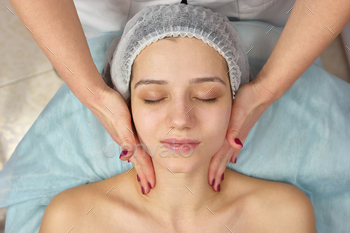 ung woman. How to relieve facial stress.